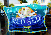 Painted "closed" sign with angel