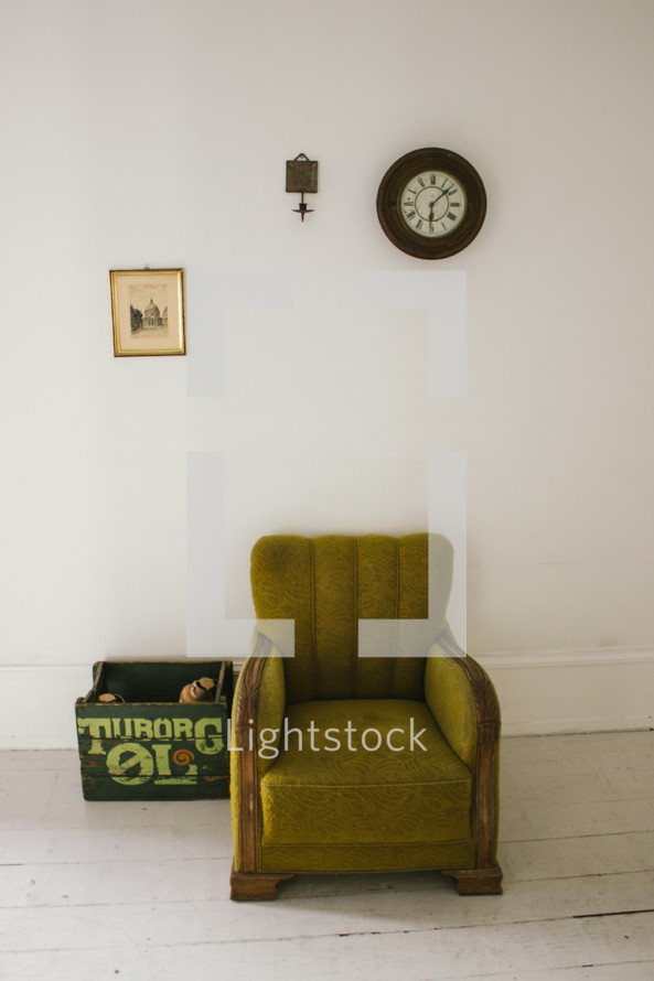 a green armchair in a room 
