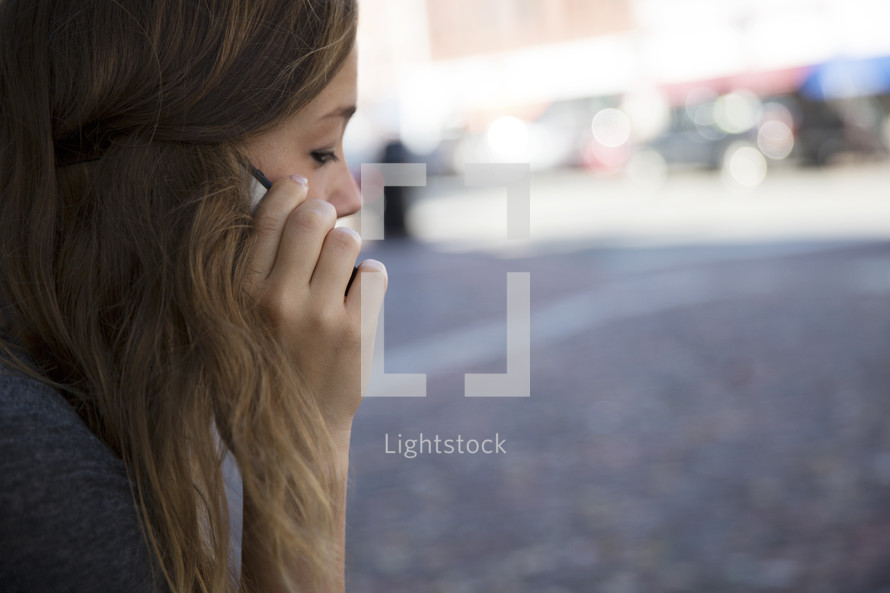 a young woman talking on her cellphone 