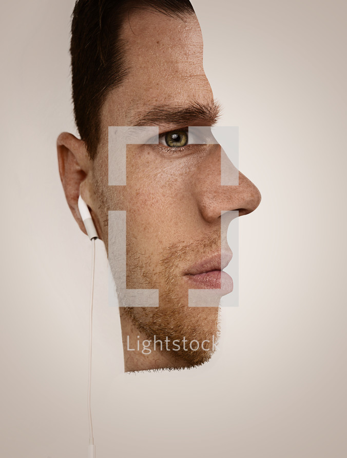 Optical illusion of half a man's face with earbuds.