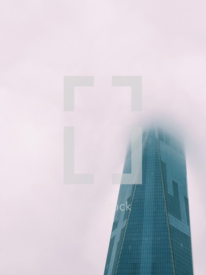 skyscraper in fog 