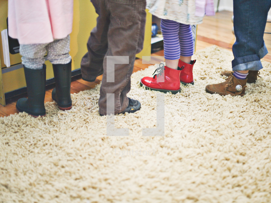 children wearing rain boots