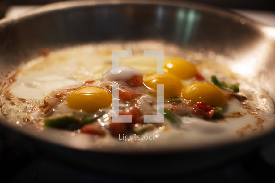 making omelets in a frying pan 