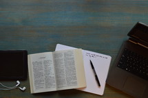 modern bible study with technology at 2 Samuel on cyan desk
