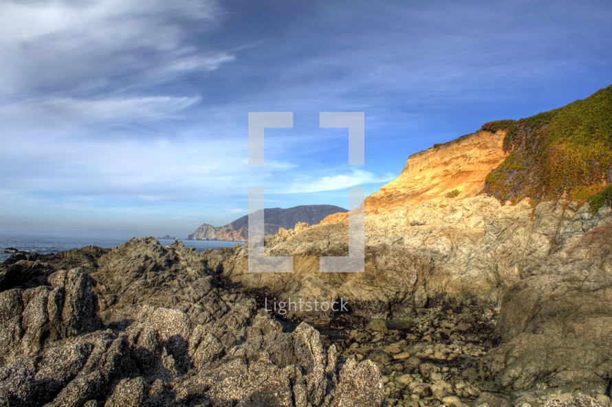 rocky cliffs along a coastline 