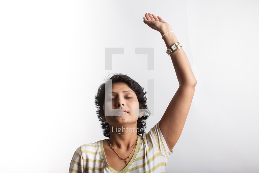 a woman standing with raised hand