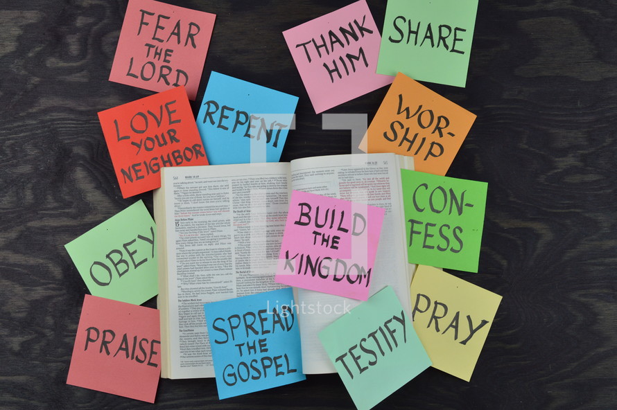 opened Bible with messages on sticky notes 