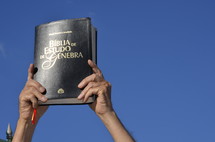 Elder holding a Bible 