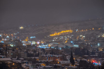 Snowy night city lights
