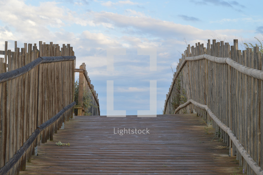 wooden path leading to a beach 