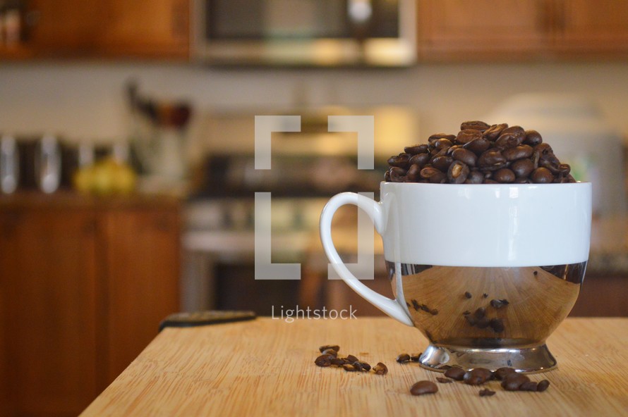 coffee cup filled with coffee beans in a kitchen 