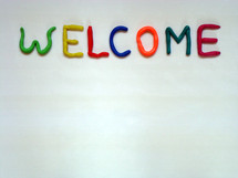 welcome in colorful dough letters, 
