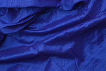 deep blue satin fabric as neutral background