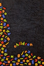 the word children in colorful magnetic letters 