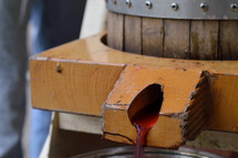 wine pouring from a wine barrel 