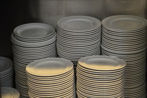piles of plates – food for many people. 

