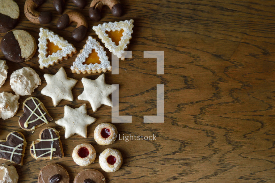 cookie assortment on wooden table as border or frame
