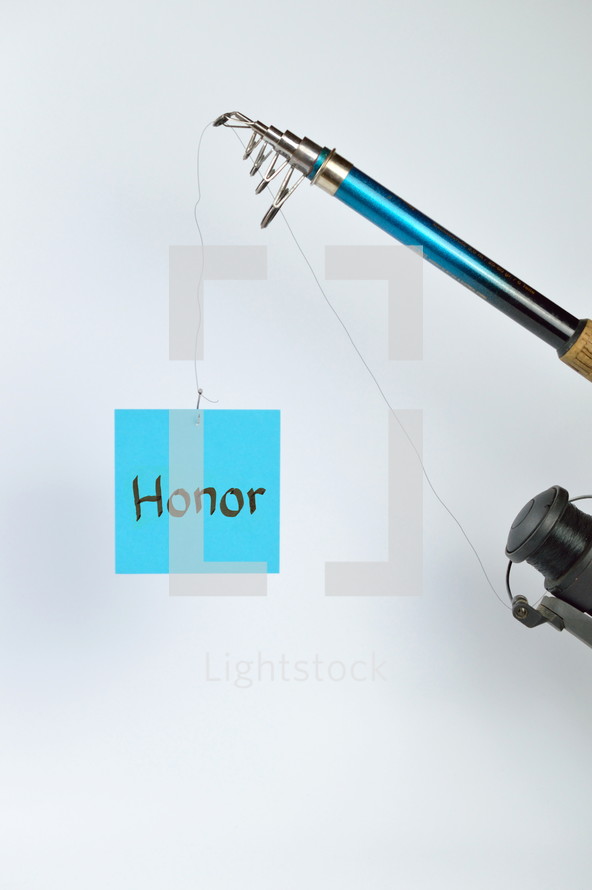 the word honor on a cyan piece of paper hanging from a fishing line 