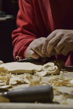 a man carving wood 