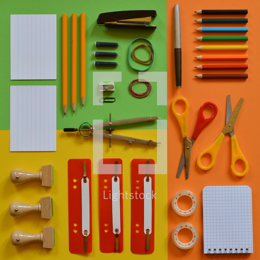 School supplies on colorful paperboard
