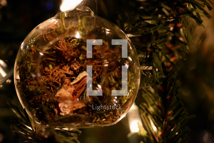 clear glass ball ornament on a Christmas tree 