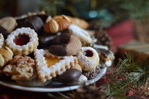 christmas cookies on a plate with christmas decoration. 
