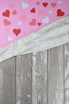 paper hearts and weathered wood boards 