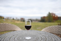 wine glass on an outdoor table 