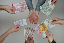 various currency and receiving hands 
