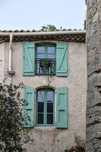 windows with green shutters 