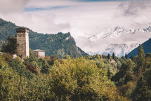 Stone tower in the autumn mountains