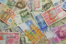 pile of currency from various countries 
