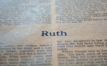 A Bible opened to the book of Ruth.