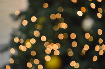 Christmas tree bokeh for Christmas in yellow, white and green. 

