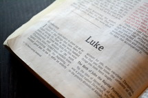 A Bible opened to the book of Luke.