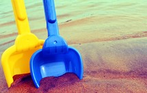 sand shovels in the sand 