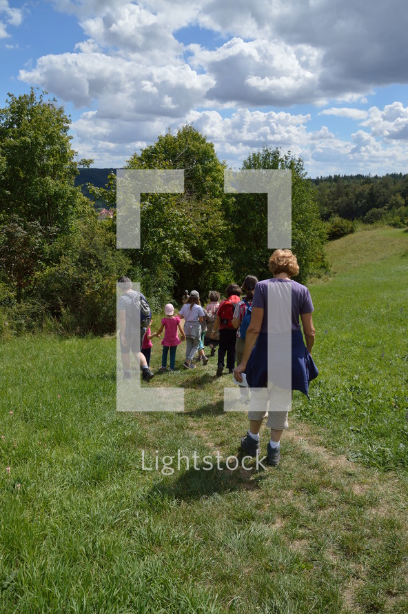 families walking on a path outdoors 