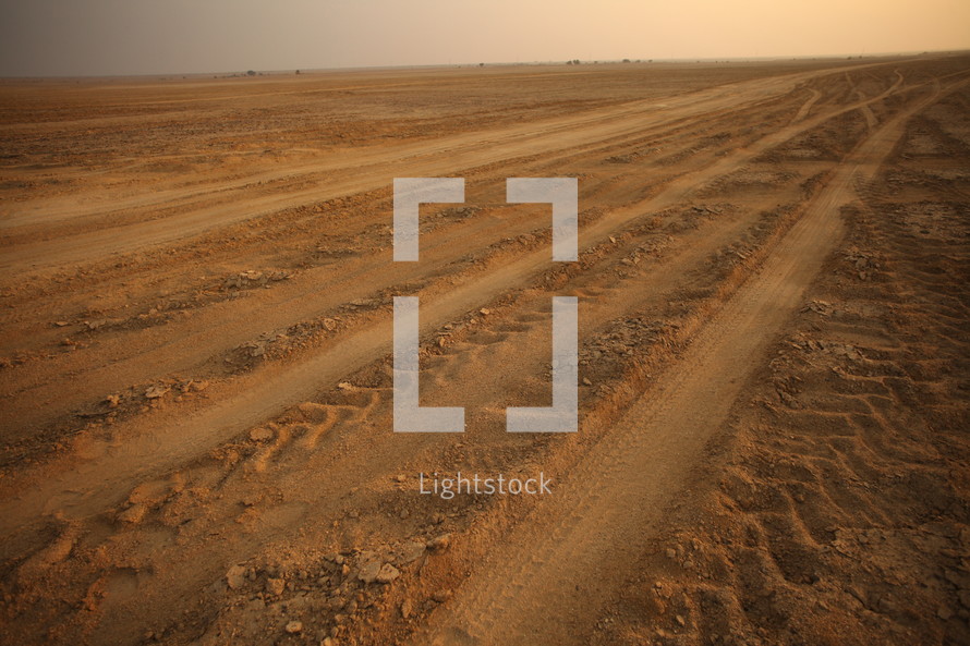 tire tracks in sand in the desert 