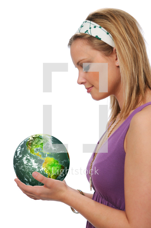 Woman with a green earth in her hands.