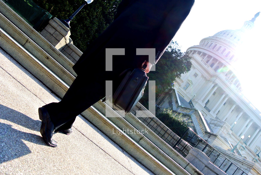 Politician and businessman walking on a sidewalk in Washington DC 