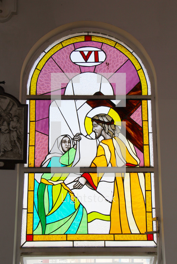 Stained glass window depicting Stations of the Cross. Number  6