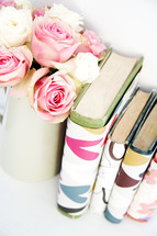 vase of roses and books 