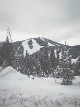 snow and ski slopes on a mountain peak 