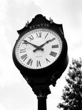 A Large clock stands in the downtown section of Eustis as a historic time piece and center of Downtown commerce and business. 