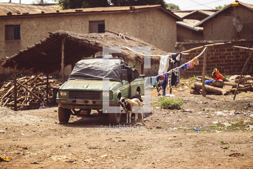 Old green broken down pickup truck Dusty village in the Ivory Coast West America
