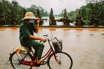 A man riding a bike in Cambodia 