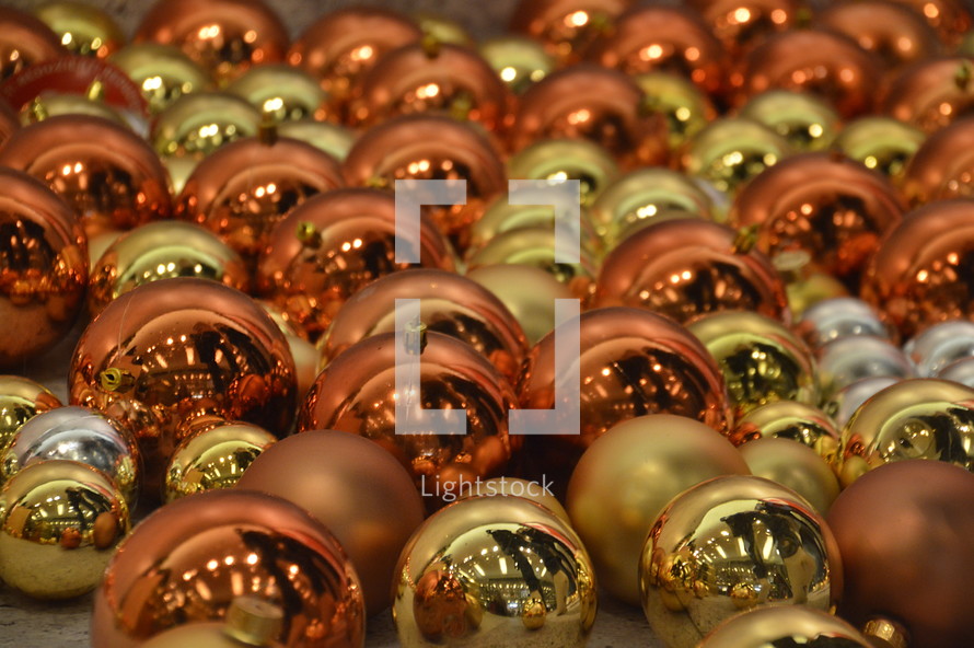 gold, silver, and copper Christmas ornaments 
