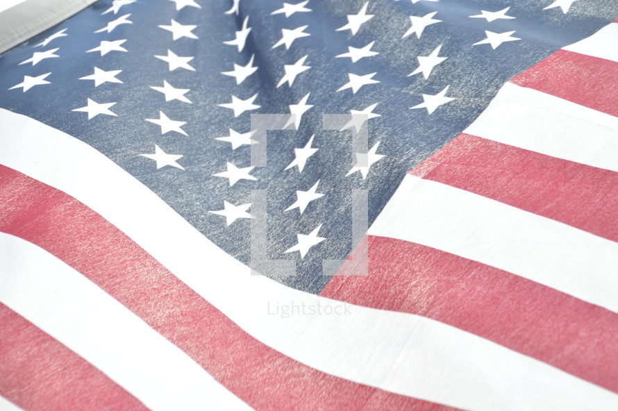 close-up of bright american flag illuminated from behind