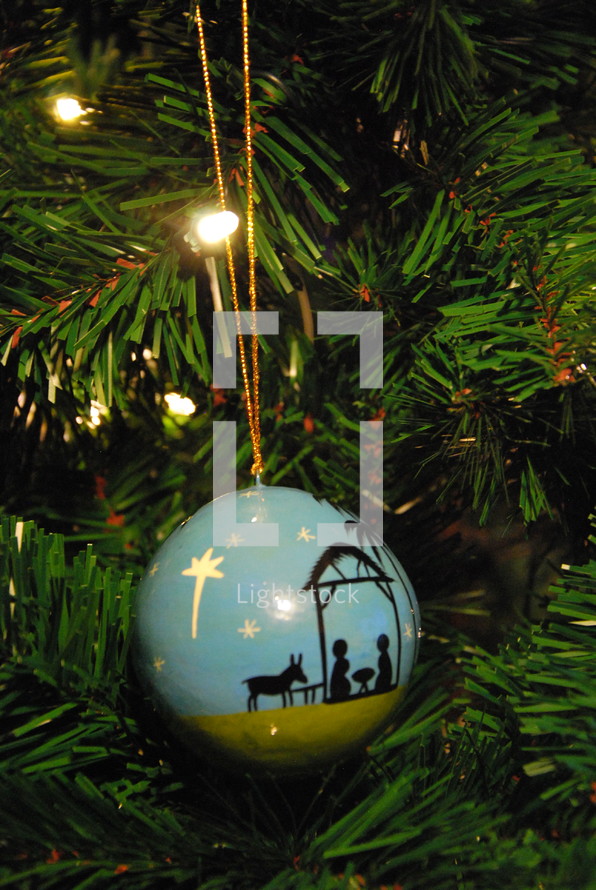 nativity ornament on a Christmas tree