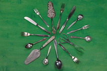 silverware on a green background 